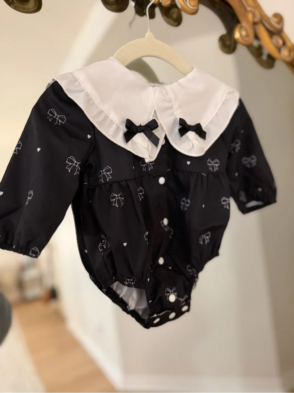 Black Bow-Print Baby Romper with White Peter Pan Collar